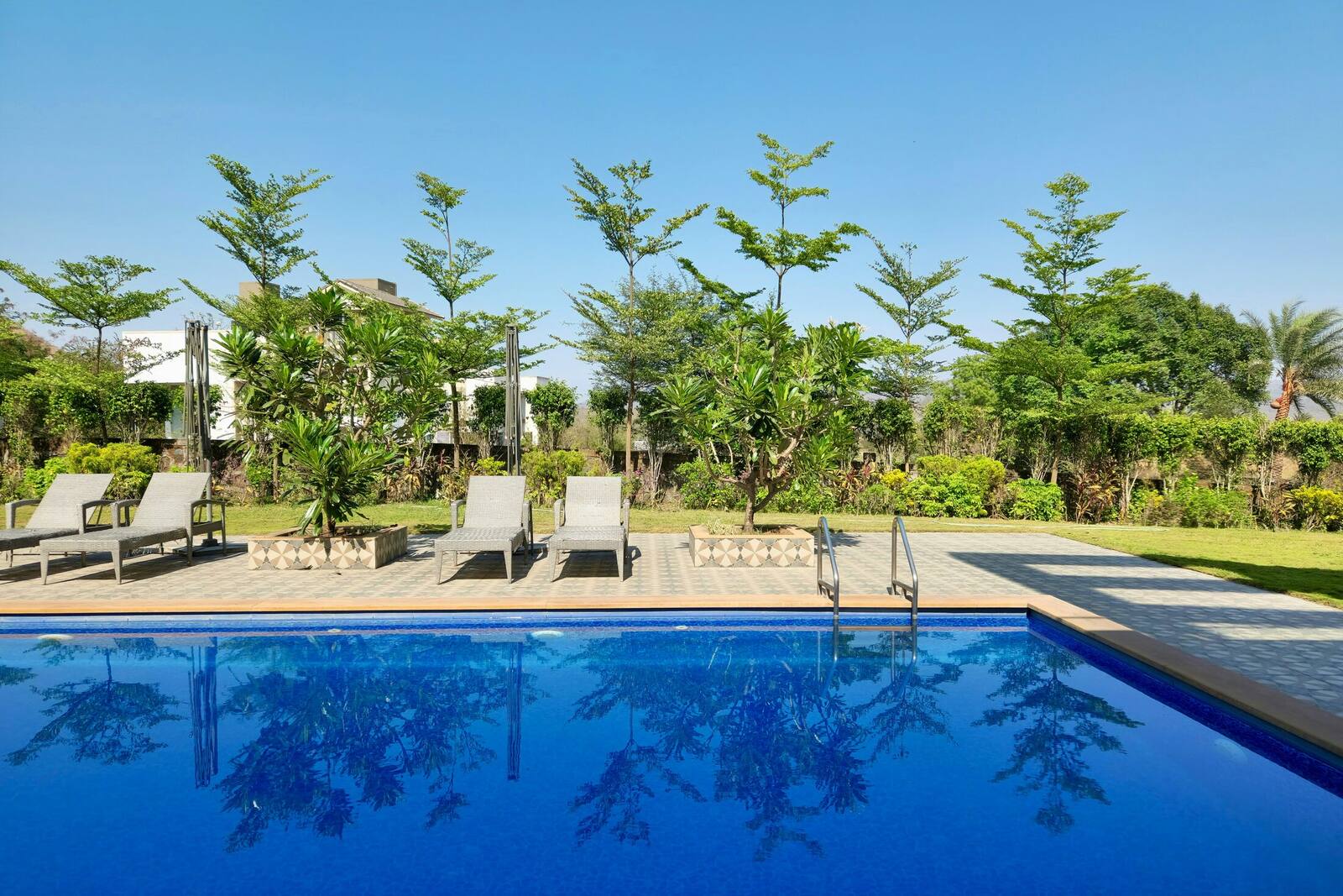 A thriving residential community with a resort pool and landscaped grounds